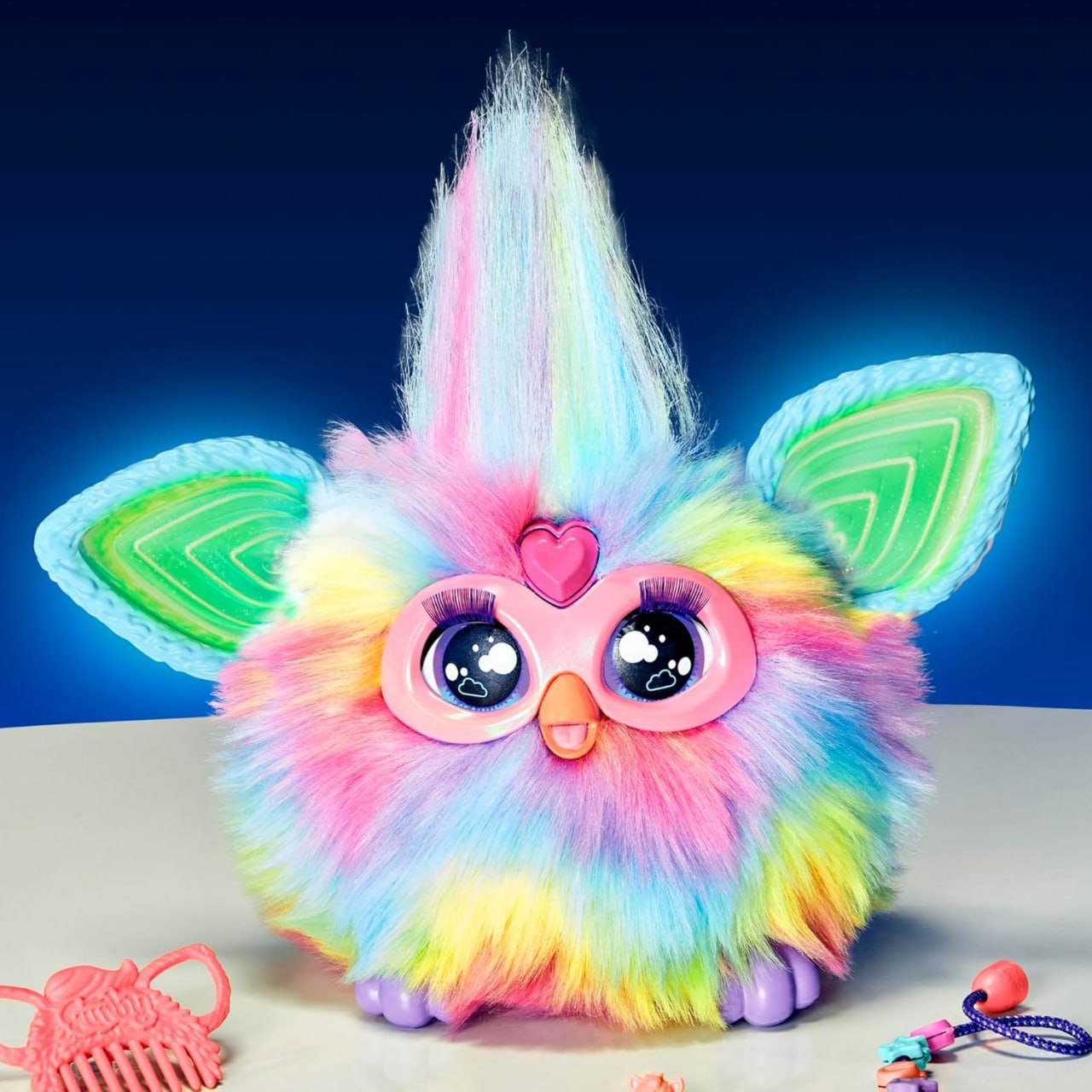 Furby Tie Dye — интерактивная мягкая игрушка с 15 модными аксессуарами. Подходит для девочек и мальчиков от 6 лет. Аниматроник с голосовым управлением для увлекательной игры и общения